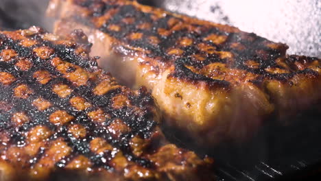 grill smoking hot beef steak in pan for dinner