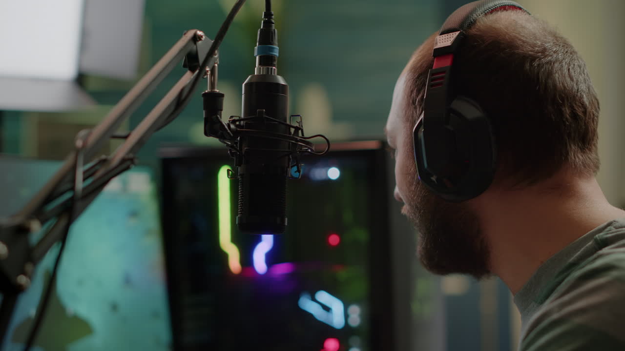 Pro streamer sitting on gaming chair talking with players using micorphone