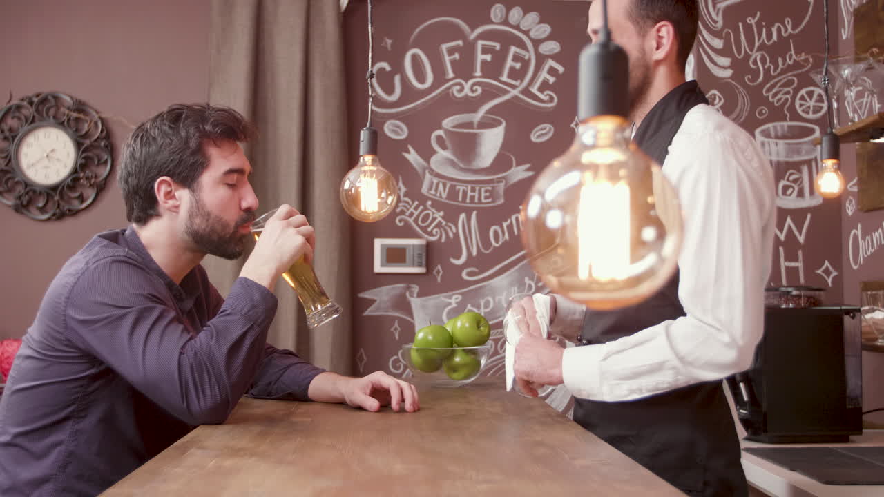 Man at bar with bartender