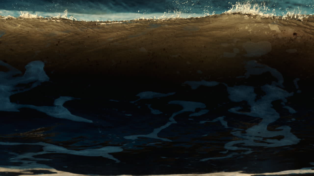 Ocean waves breaking and foaming as they approach the shoreline