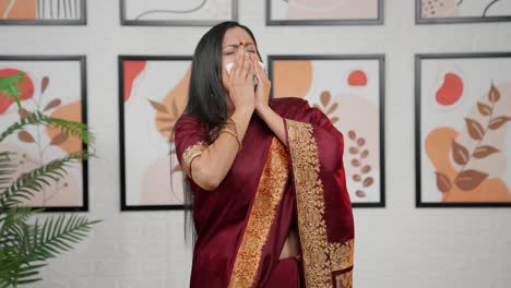 indian woman catching cold and sneezing