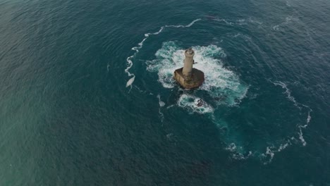 A-rotating-overhead-shot-of-Phare-du-Four-a-lighthouse-in-Bretagne-France