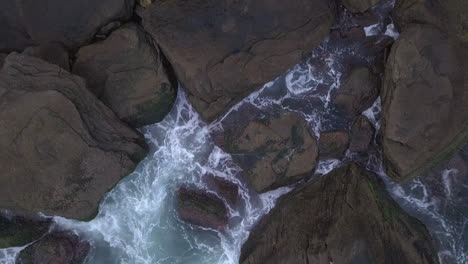 Top-view-of-waves-and-rocks