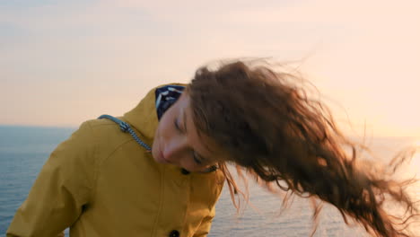 woman by the sea at sunset