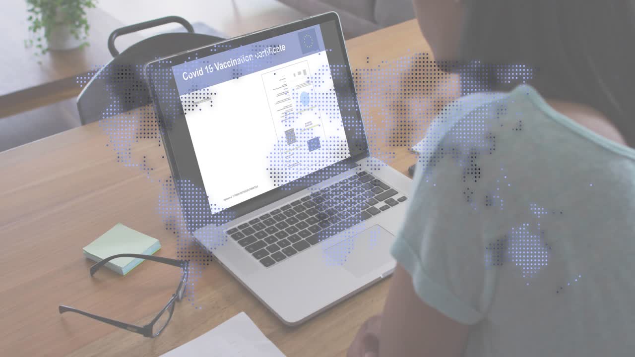 Man tapping laptop and scrolling certificate, revealing world-map overlay to check health status