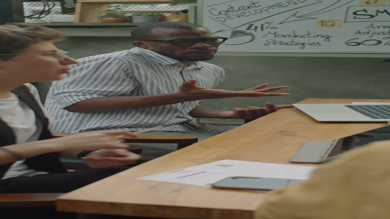 Diverse Colleagues Having Discussion at Outdoor Business Meeting