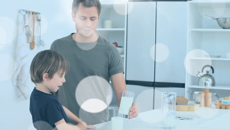 animación de manchas blancas sobre un padre caucásico feliz bebiendo leche con su hijo