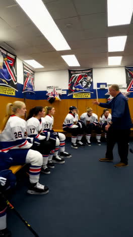 women's ice hockey team meeting in the locker room