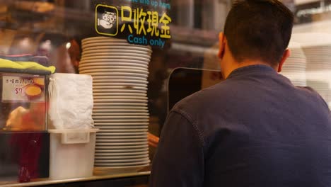 customer interaction at a dessert bakery counter