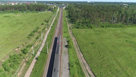 two passenger electric trains are moving along the railway track. counter traffic of trains