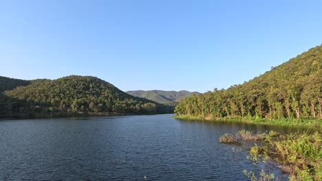 time-lapse of a serene lake and surrounding hills