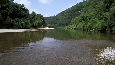 clear water flowing on the buffalo national river slight pan shot