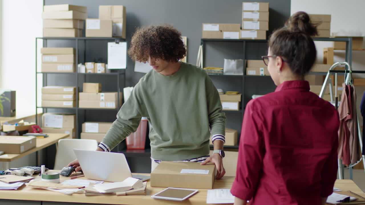 People working in an office with boxes