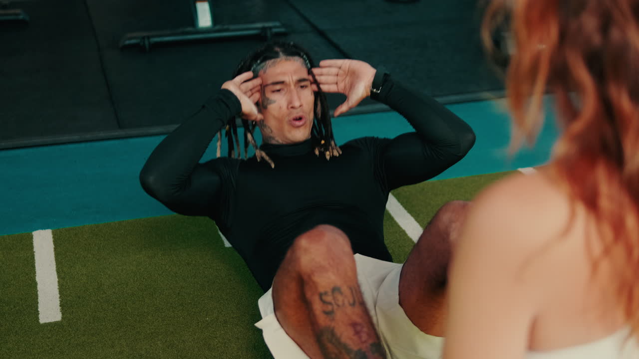 Man doing sit-ups in the gym