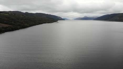 Aerial-Flying-Over-Waters-Of-Loch-Ness-With-Clouds-Overhead