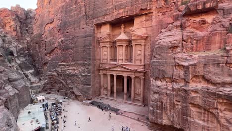 petra valley from above in wadi musa, jordan with the treasury in the middle of a rocky and mountainous landscape, an unesco heritage site, ancient nabatean kingdom 4k establish shot