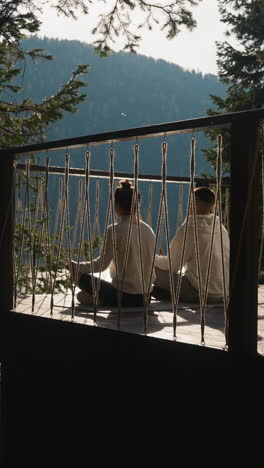 couple engages in daily rituals at gampling. partners find serene connection with nature fostering profound sense of harmony sitting in lotus pose