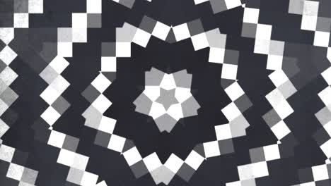 circular geometric black and white pattern with small squares