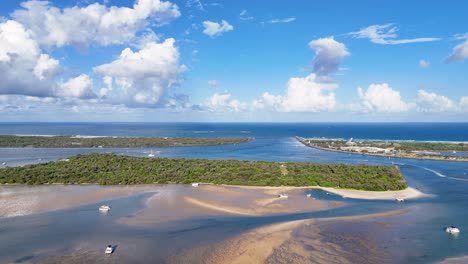 aerial view of river meeting the ocean