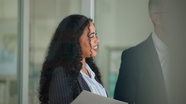 Smiling Businesswoman Listening Attentively in a Corporate Meeting