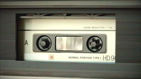 close-up of a cassette tape in a tape player
