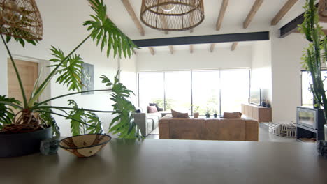 modern living room with large windows and stylish furniture, creating cozy ambiance