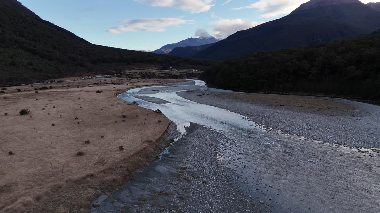 Drone flight over the river that flows through the Mount Aspiring Valley on New Zealand's South Island