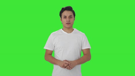 indian man looking at the camera green screen