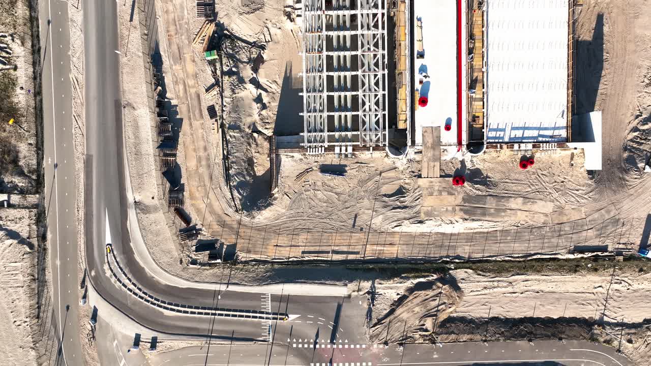 Top down aerial view of a a bridge being constructed on dry land