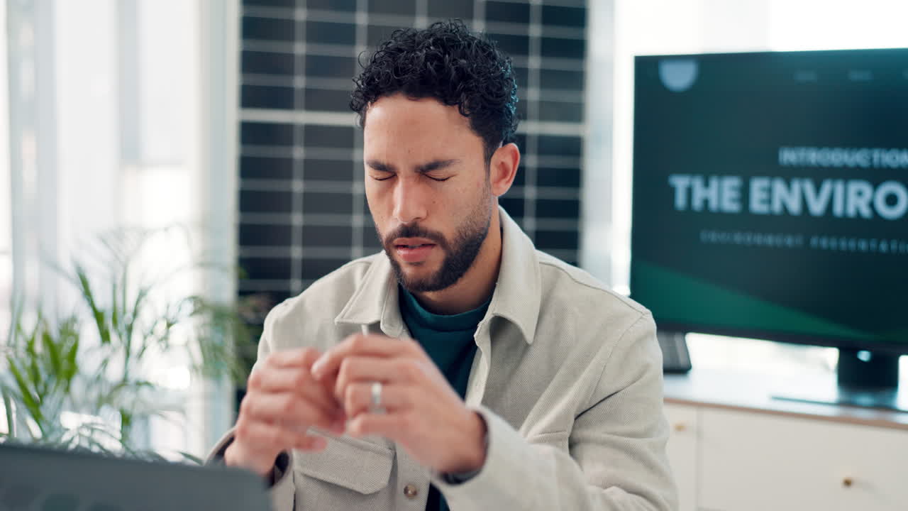 Young Man Rubbing Tired Eyes While Working on Laptop