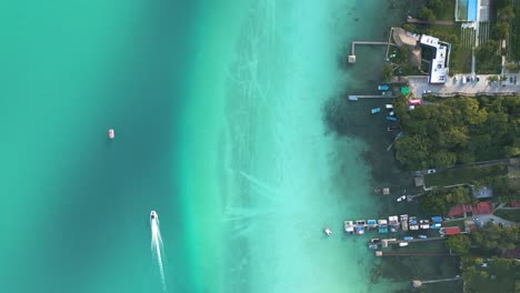 aerial view of bacalar lagoon coastline with hotel and resorts along the shoreline, quintana roo, mexico