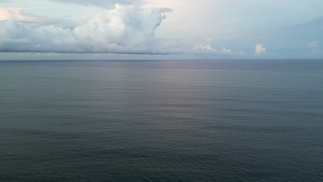 ocean with matte texture morphs far below in bali indonesia