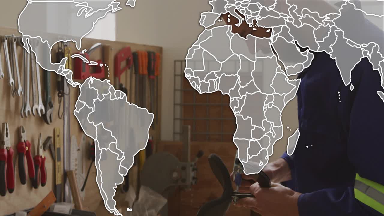 Map overlay appearing and expanding, handyman leaning workshop and inspecting drill battery fit