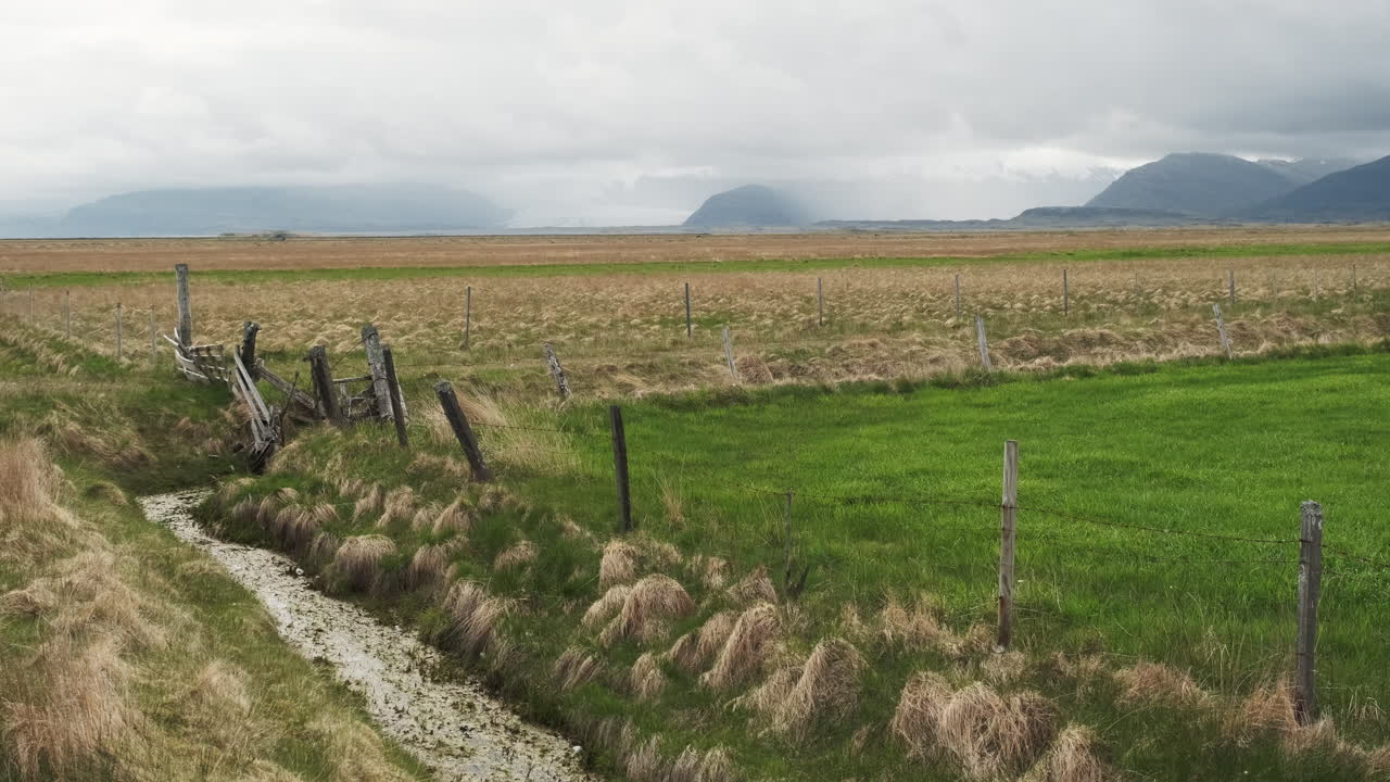 Slow Pan Of Icelandic Countryside Farmland