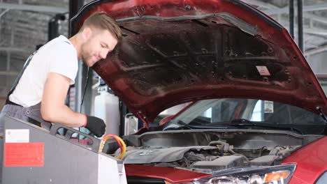 mechanic working on a car engine in an auto repair shop