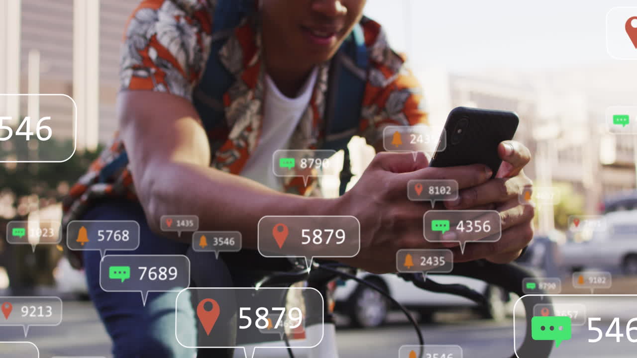 Animation of media icons over african american man using smartphone