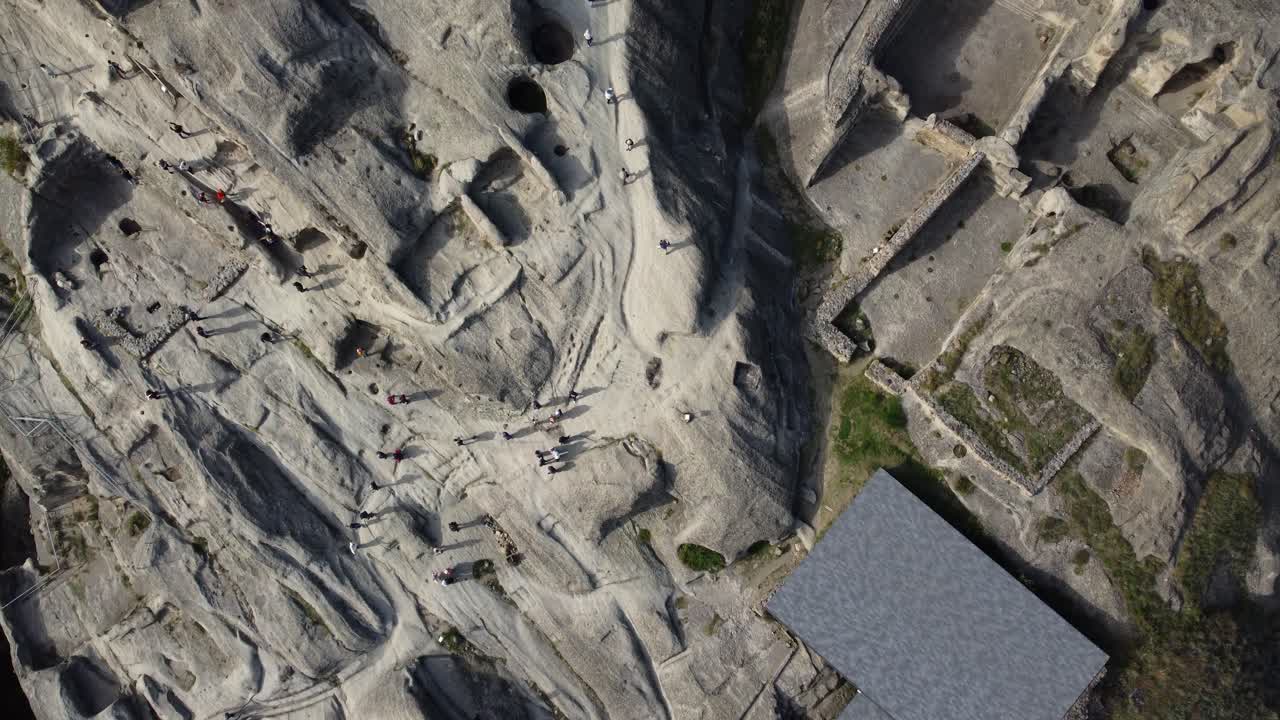 Drone of rocky Uplistsikhe caves showing ancient settlement carved into cliffs