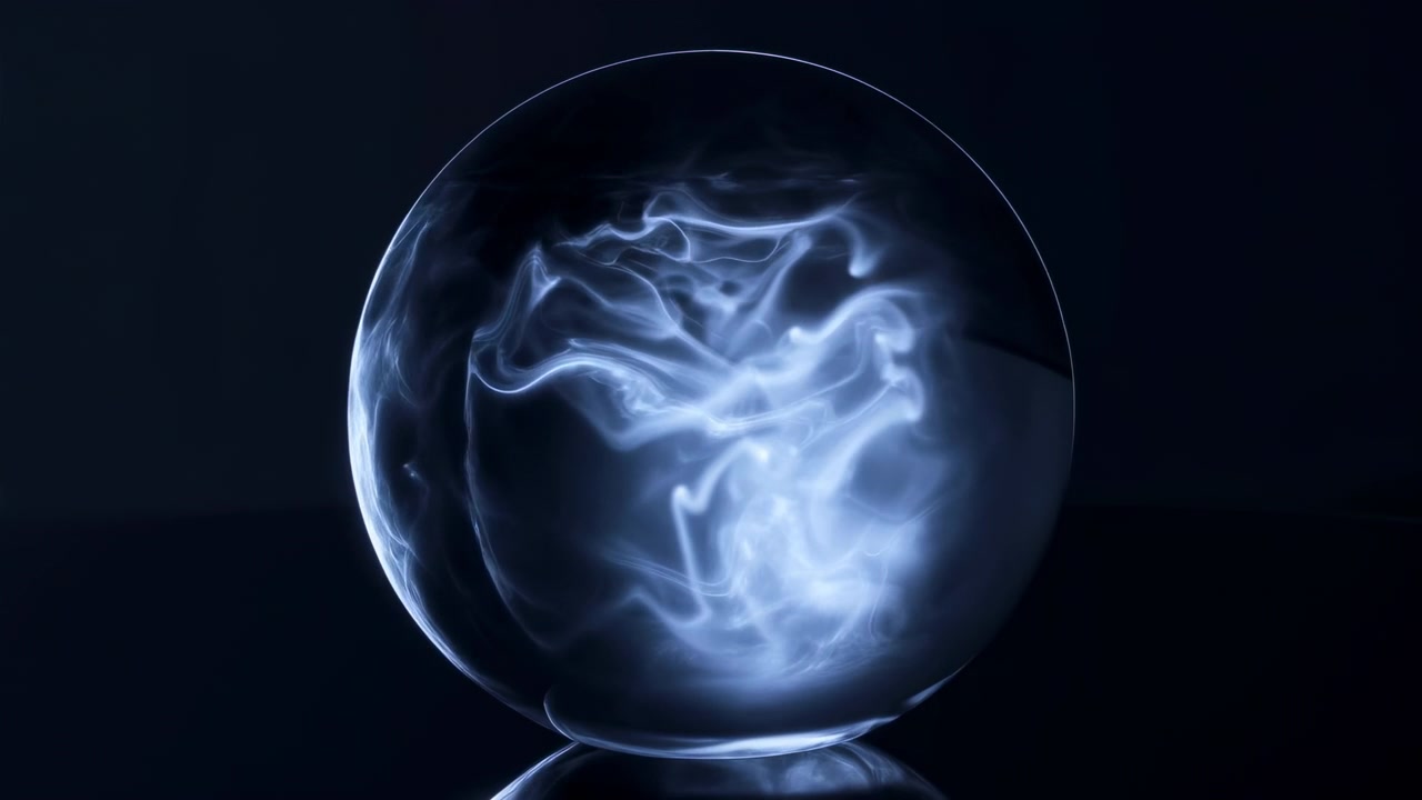 Polished glass sphere holds blue white smoke that rises through center and upper interior, curling into layered ribbon plumes with glowing core, translucent depth, soft contrast, moody darkness