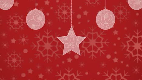 animación digital de adornos navideños y estrellas contra copos de nieve impresos sobre fondo rojo
