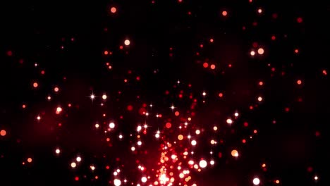 partículas de brillo rojo. brillo de oro rojo bokeh en un fondo oscuro, luz mágica, glamour, vacaciones. hermosa animada navidad, fondo del día de san valentín. brillante tesoro mágico. bucle sin costuras
