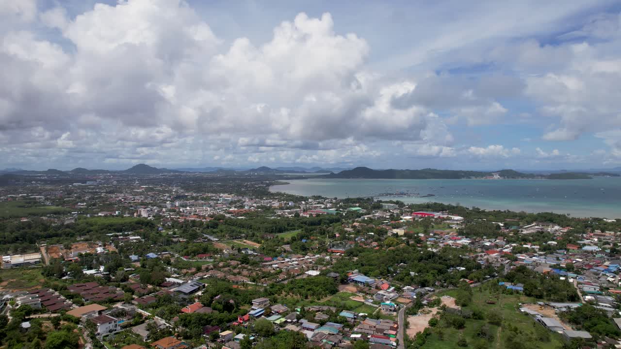 Phuket, aerial drone shot over a Rawai Mueang district on a beautiful sunny day, a turquoise lagoon facing Phi Phi island in a famous Thailand tourist location
