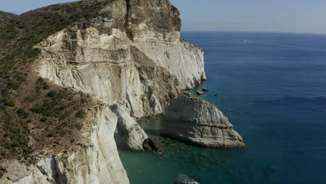 klefitko beach and white cliffs drone aerial shot over the blue waters and dramatic coastline of the greek island of milos, greece in 4k