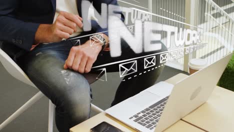 animation of social network text and icons over man using smartwatch and laptop