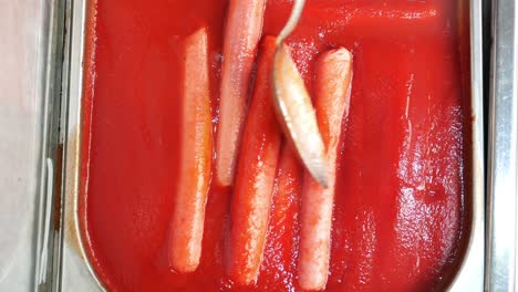 hot dogs in tomato sauce