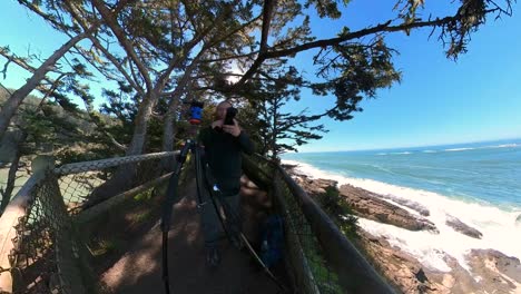 a photographer takes pictures on the oregon coast