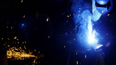 welders welding a metal