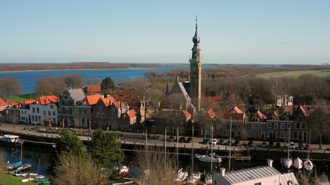 Picturesque European Town with Tower and Water Views