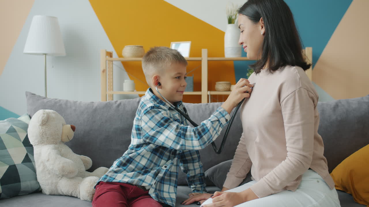 Mother and Son Play Doctor at Home
