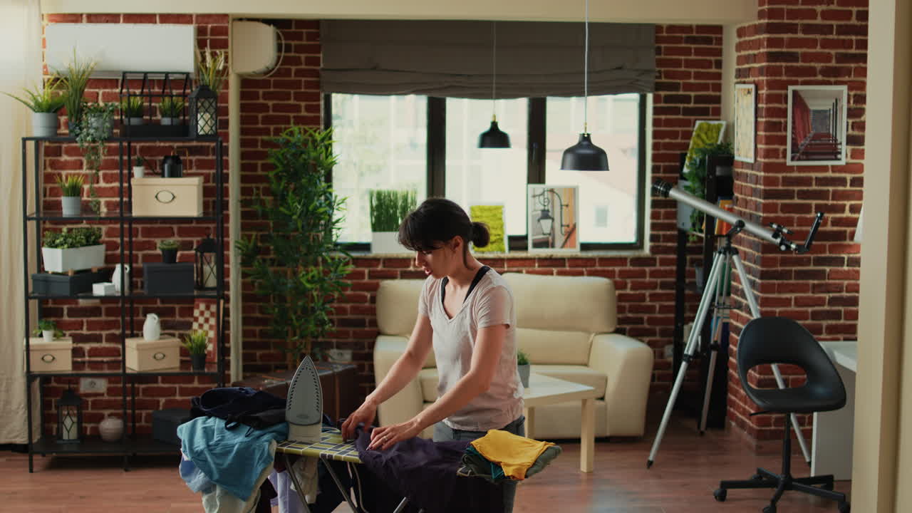 Furious wife throwing garment at husband