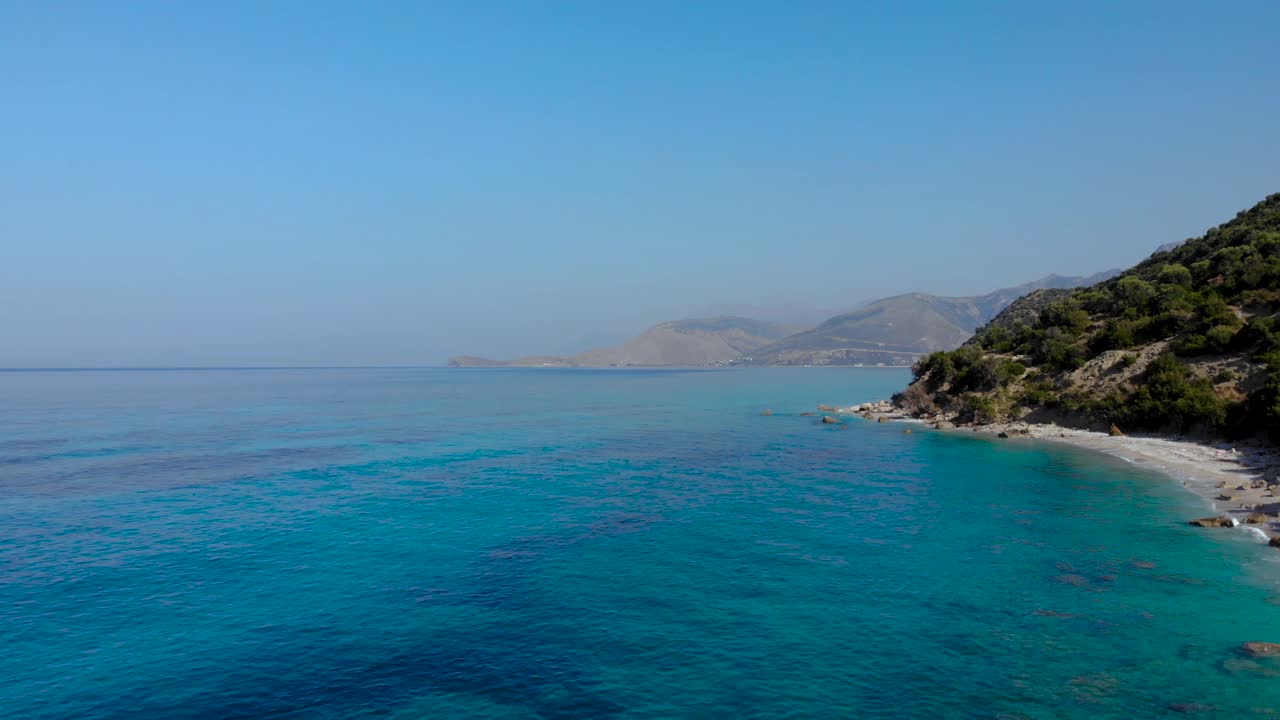 Blue azure sea water on shoreline of Mediterranean, calm emerald lagoon washing mountains